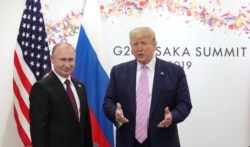 Владимир Путин и Дональд Трамп во время встречи G20 в Японии, июнь 2019 года