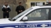 Azerbaijan -- Local residents look at a police car patrolling streets after recent mass protests in the town of Ismayilli, 25Jan2013